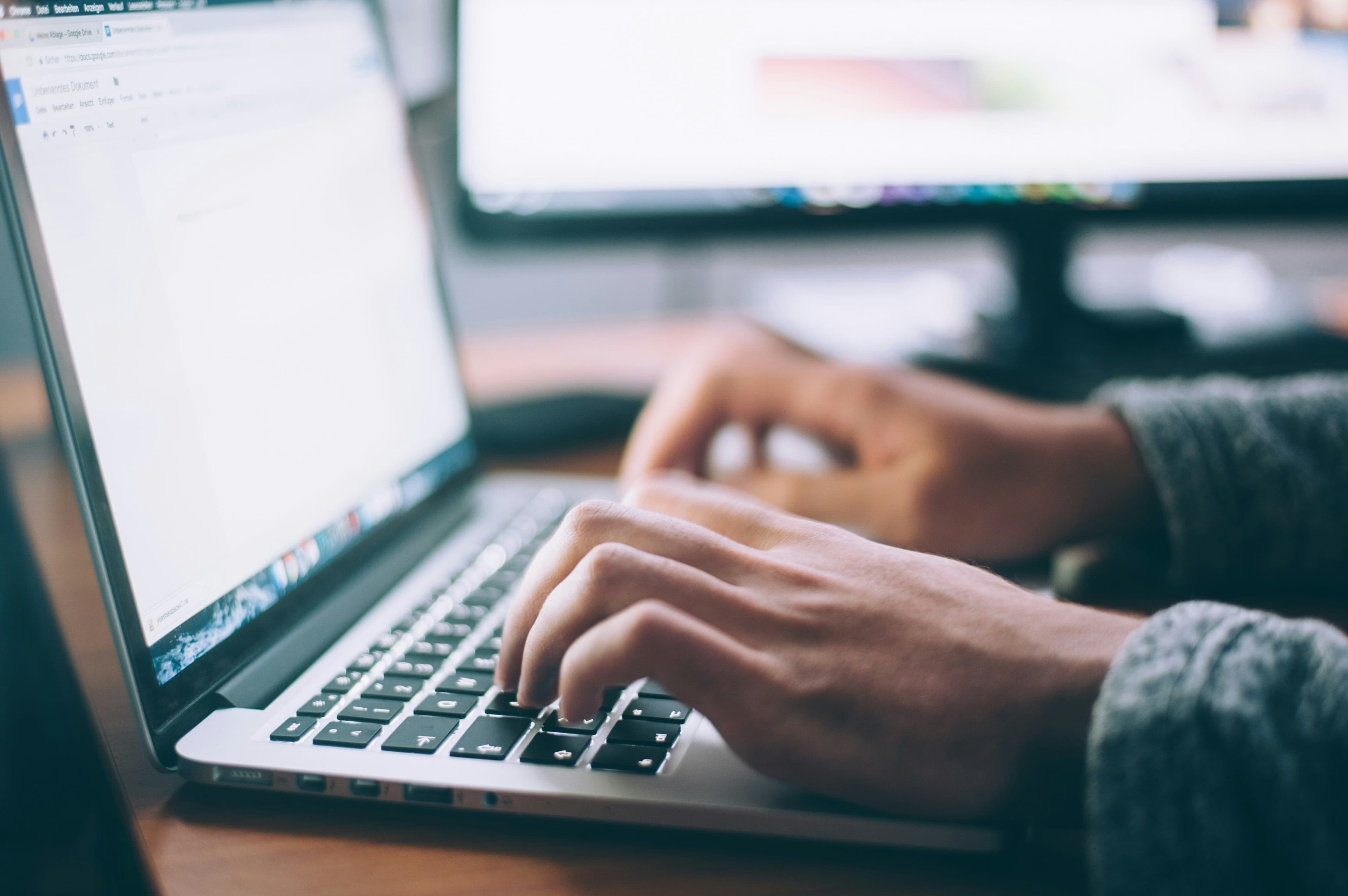 Person searching Software Engineer Job Boards on laptop